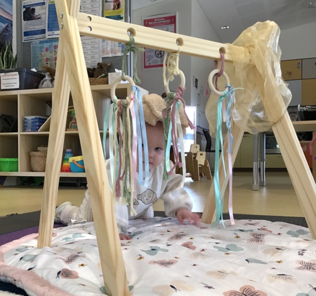 baby crawling on mat